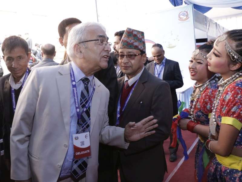 Dr Bhola Rijal interacts with 'panchakanyas' during the Nepal Investment Summit. Photo: NBA