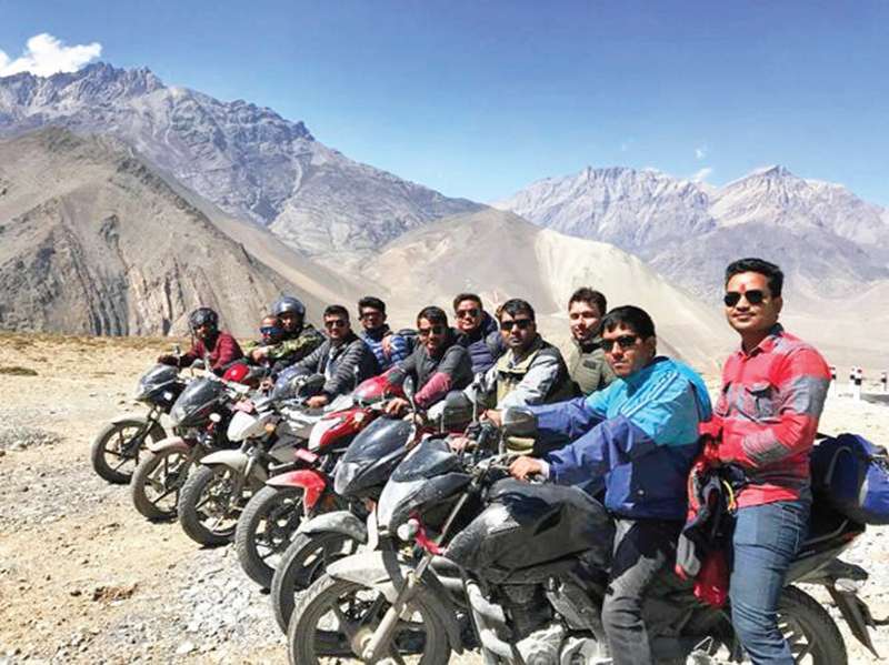 Youths of Gaighat, the district headquarters of Udayapur, pose for a group photo in Muktinath, a religious pilgrimage site of Mustang district. Domestic tourism in the mountainous district has increased due to road access to the remote region. Photo: Ajaya Kumar Shah/Aarthik Abhiyan