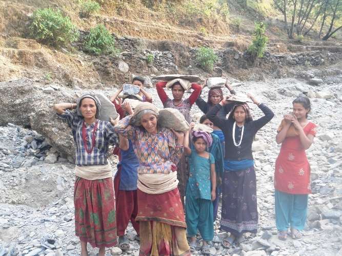 Women involved in construction work in Aathbiskot Municipality of West Rukum. Women in this district are in the forefront of development works as the men are away for employment in India and other countries. Photo: Prabir Dadel/Aarthik Abhiyan