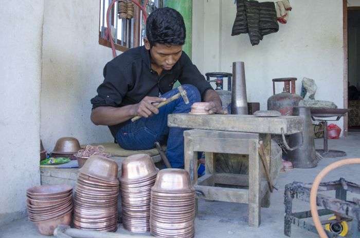 A local coppersmith of Mulpani making utensils especially for religious purpose. The braziers have been exporting such utensils to China and other foreign countries. Photo: Sagar Basnet/Aarthik Abhiyan