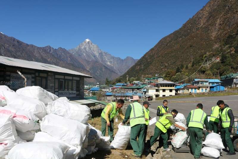 Staff of Tara Air prepare to load waste at Lukla airport. The airlines in collaboration with Sagarmatha Pollution Control Committee (SPCC) and the Himalayan Club carried away 11,000 kg of waste from the Khumbu region as part of its corporate social responsibility. Photo: Tara Air


