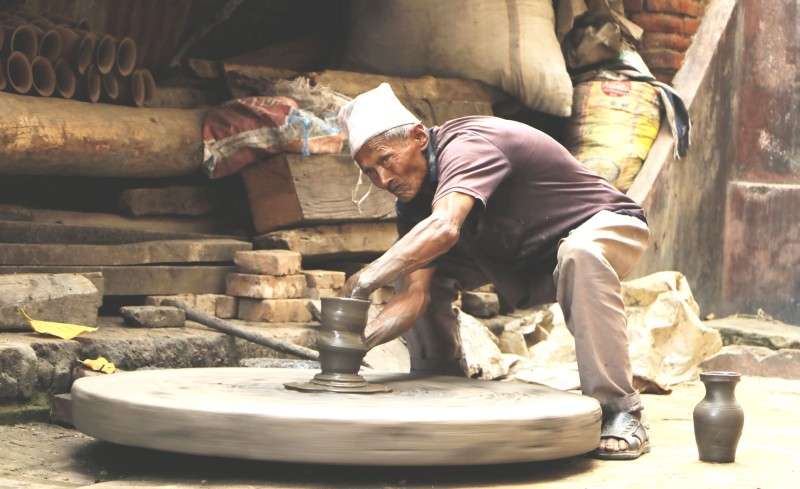 A local of Bhaktapur making pots at Bhaktapur Durbar Square on Tuesday. Bhaktapur is renowned for pottery but the new generation has lost its interest in this ancient craft. Photo: Pradip Luitel/NBA