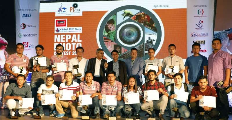 Winners of Global IME Photography Awards pose for a photo after winning awards in various categories amid a function in the capital on Thursday. Photo: Ravi Maharjan/NBA