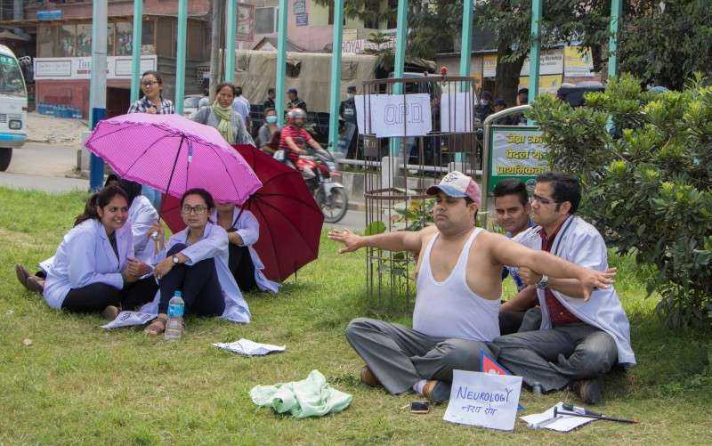 Supporters of Dr Govinda KC staging protest at Maitighar Mandala in Kathmandu on Tuesday. Dr KC has been staging his 15th fast-unto-death in Jumla since the last 18 days demanding reforms in medical education sector. Photo: Pradip Luitel/NBA