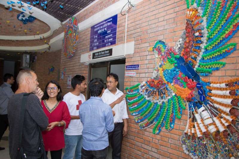 Visitors at Kanti Children’s Hospital in Maharajgunj observing arts set up under the ‘Health transformed by arts’ project. The hospital started using arts with a belief that it will have positive impact on health of the patients. Photo: Pradip Luitel.NBA