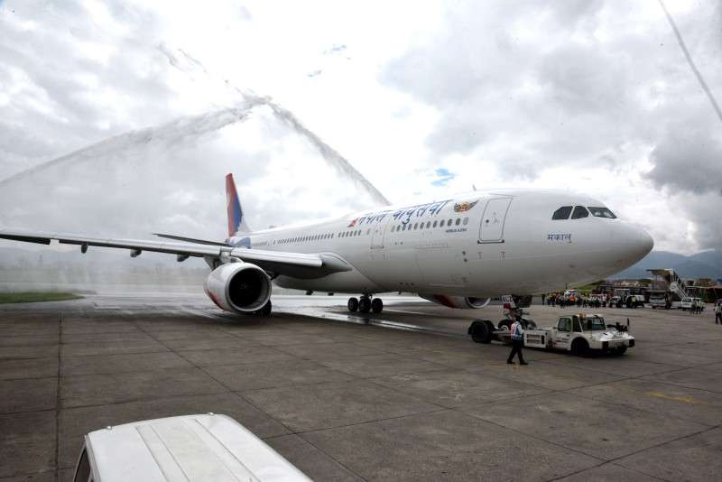 Nepal Airlines Corporation welcomes its new wide-body aircraft Airbus A330-200 with water canon at the Tribhuvan International Airport on Thursday. The aircraft with call sign 9N-ALZ has a capacity of 274 seats out of which 18 seats are for business class. Photo Courtesy: NAC
