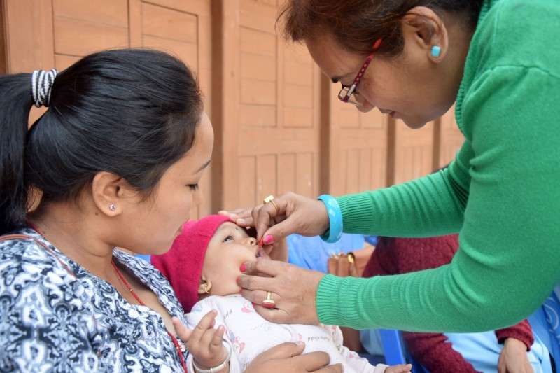 A health worker administering Vitamin A capsule to a child in Kathmandu on Wednesday. Photo: Monika Malla/NBA