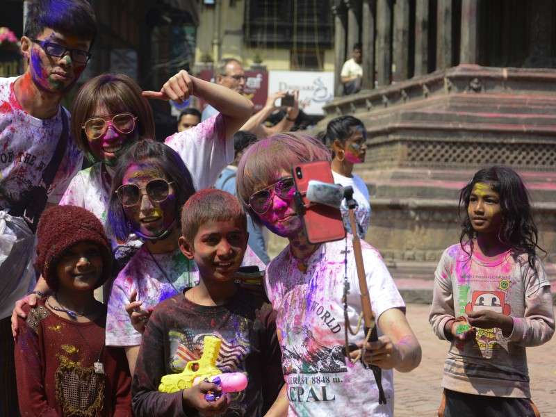 People taking selfie during the festival of Holi on Wednesday. Photo: NBA