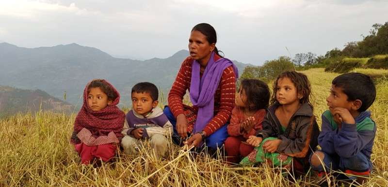 Mansari Bista of Thatikadh Rural Municipality in Dailekh district along with her children expresses her sorrow at their farm following the destruction of her crop by last Friday’s hailstones. Photo: Pankha Bahadur Shahi/NBA