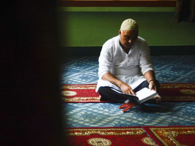 A Muslim follower reading the Quran at a mosque in Lalitpur on the first day of the festive month of Ramadan. Ravi Maharjan/NBA